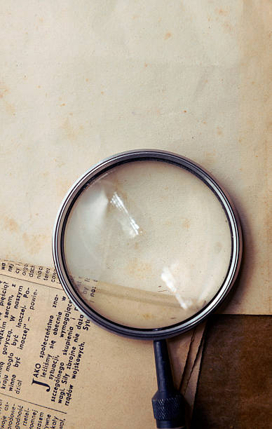 istock Vintage background with magnifying glass 628363506