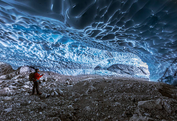 istock Hiker in ice cave,  Bavarian Alps - Berchtesgaden National Park 628363788