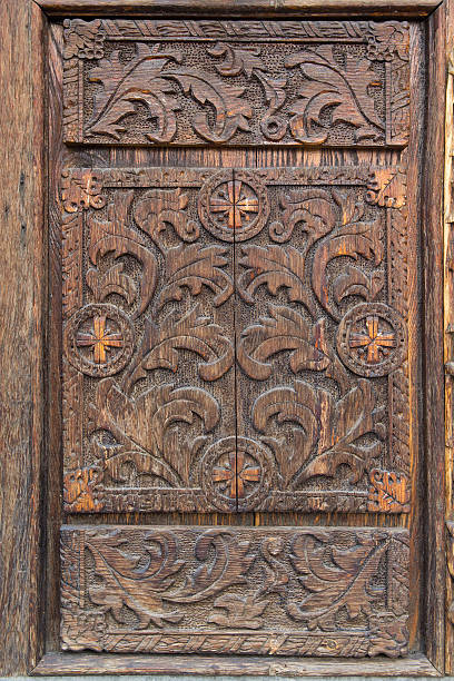 istock Old wooden door with carved patterns. Architecture 628365540