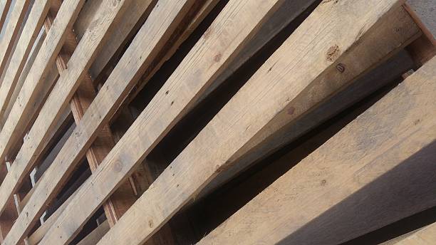 istock Wooden pallets are stacked for use with industrial usage 628366570