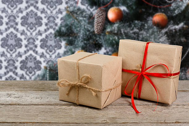 istock Christmas present on decorated tree background, holiday concept 628367502