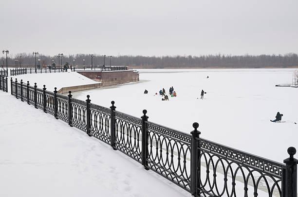 istock Winter. Fishermen amateurs  on the river 