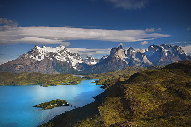 Torres del Paine The mountainous landscape of the amazing Torres del Paine which borders both Chile and Argentinia in Patagonia andes mountains chile stock pictures, royalty-free photos & images