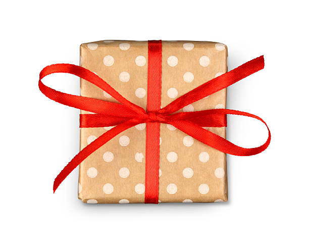 scatola regalo per le vacanze di natale in carta maculata isolata su bianco - holiday paper spotted close up foto e immagini stock