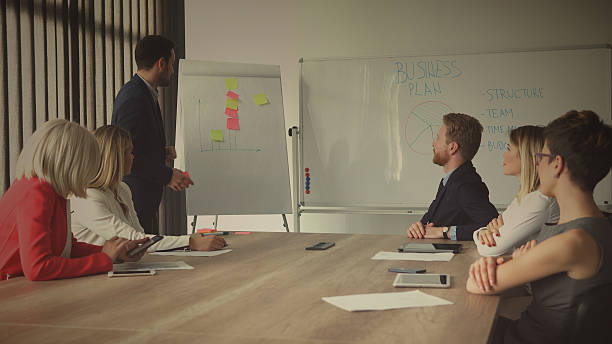 istock Group of business people in office. 628390220