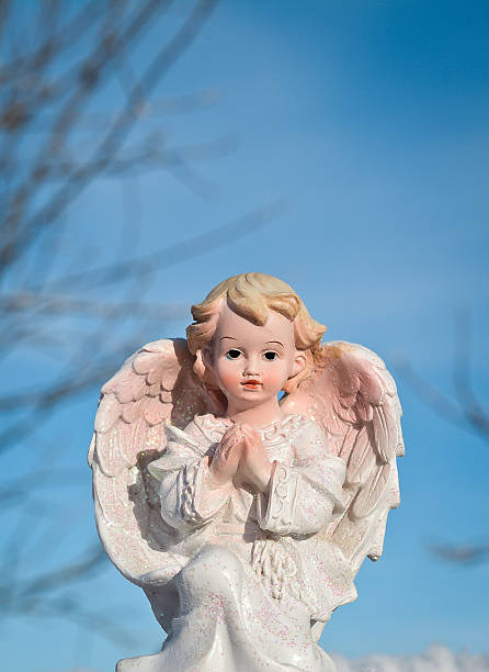 Guardian angel on blue sky background. Religion and faith concept One Guardian angel on blue sky background. Religion and faith concept friedrich engels stock pictures, royalty-free photos & images