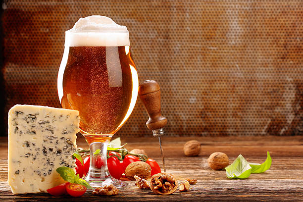 istock Blue cheese appetizer and beer on brown vintage background 628390986