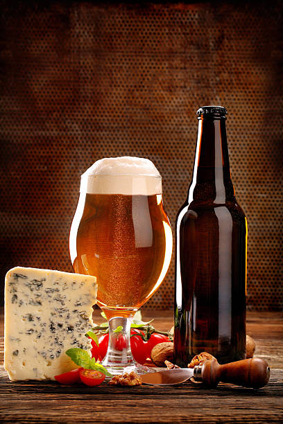 istock Blue cheese appetizer and beer on brown vintage background 628391104