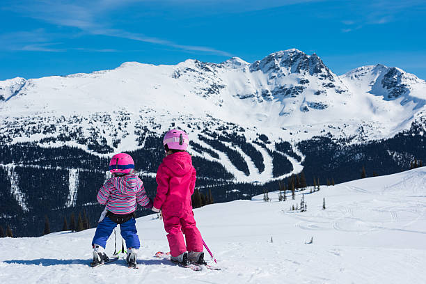 istock Sisters skiing in the mountains 628391154