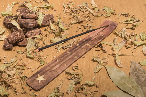 composition of incense sticks, pine bark, dry leaves of linden trees, bay leaf