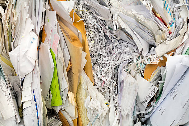 piles of paper shredded and ready to recycle - recycling paper garbage newspaper imagens e fotografias de stock