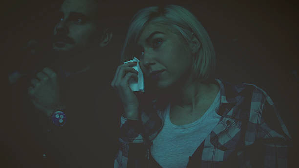 istock Women crying while watching movie in a cinema hall 628401312