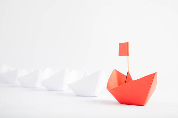 istock Red Boat Leadership Concept on White Background 628408240