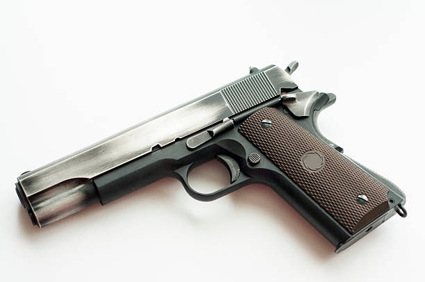 istock Handgun pistol isolated on a white background 628410038