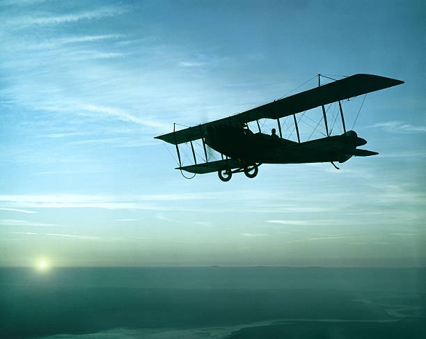 istock antique airplane flying at sunset, Standard J-1 628417662