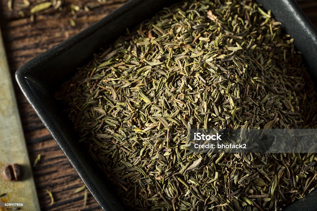 Raw Organic Dried Thyme Raw Organic Dried Thyme in a Bowl Aromatherapy Stock Photo