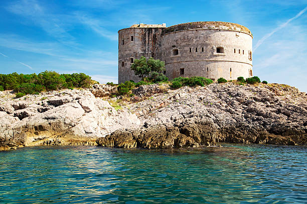 istock Old fort on the rocks island at adriatic sea 628428708