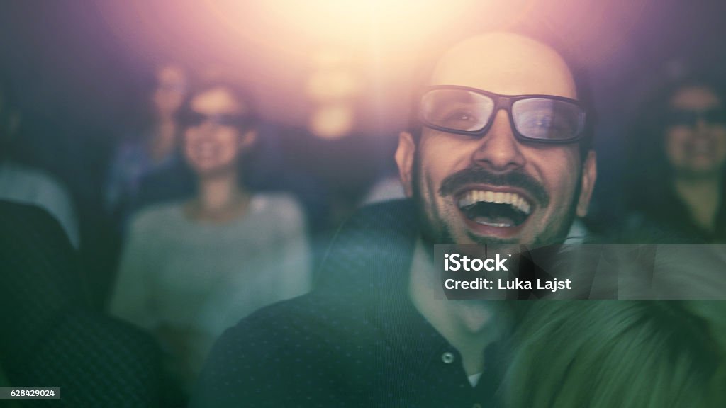 Young couple at the cinema watching movie Movie Theater Stock Photo