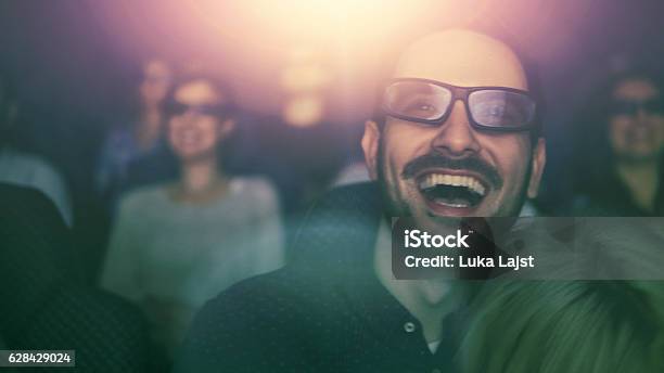 Young Couple At The Cinema Watching Movie Stock Photo - Download Image Now - Movie Theater, Audience, Film Industry