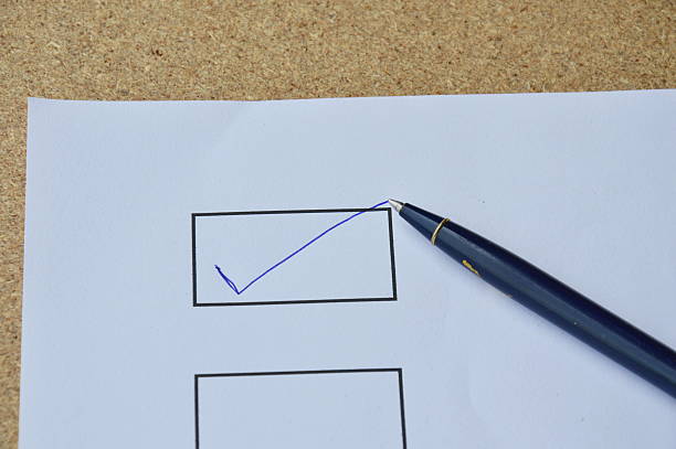 istock pen filled correct sign in the blank on white paper 628435244