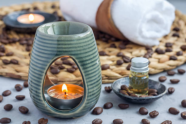 istock Aroma lamp with coffee essential oil, spa background, horizontal 628436774