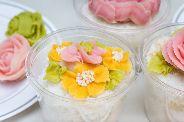 Tteok, korean rice flour steamed cake with colored bean paste decoration, vertical