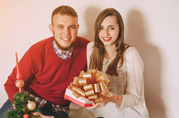 istock loving couple decorating Christmas tree 628437198