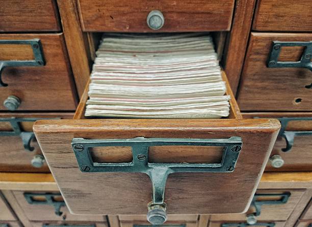 istock Open wooden boxes with index cards in library 628437880