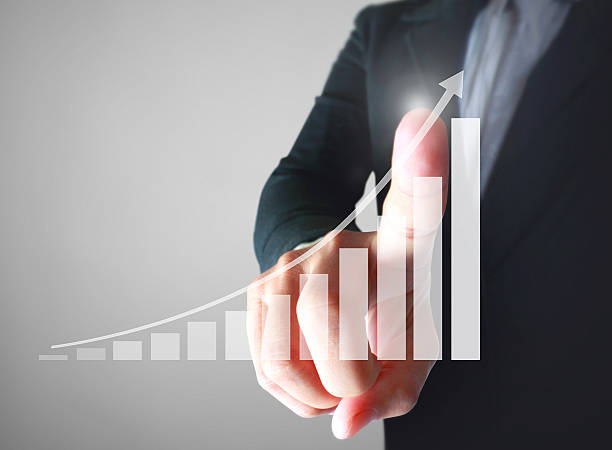 istock Businessman with financial symbols coming 628439266