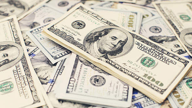 istock Heap of one hundred dollar 628440734