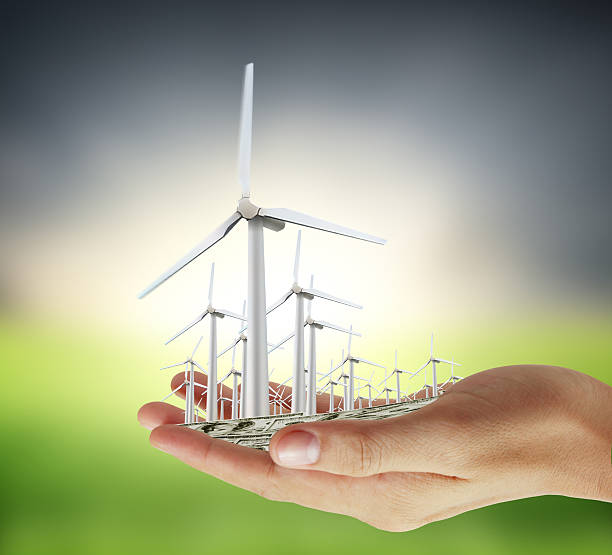istock wind turbines in the hand 628442234