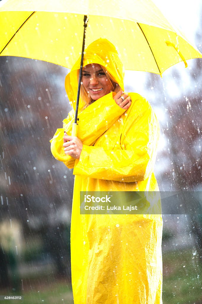 Cute girl ready for the rain! Cute girl ready for the rain!  NOTE: Add fine noise in pp, selective focus Raincoat Stock Photo