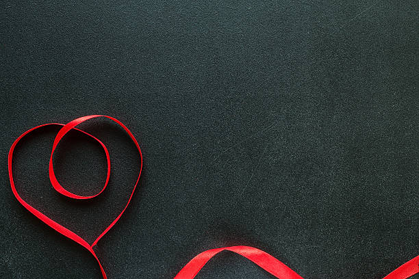 istock Valentine heart on black chalkboard. 628453232