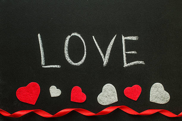istock Love Hand writes on the chalk board. 628453288