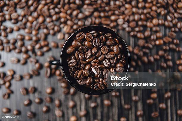 Coffee Cup And Beans On Wooden Background Top View Stock Photo - Download Image Now