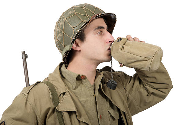 istock young American soldier drink water in his can 628454782