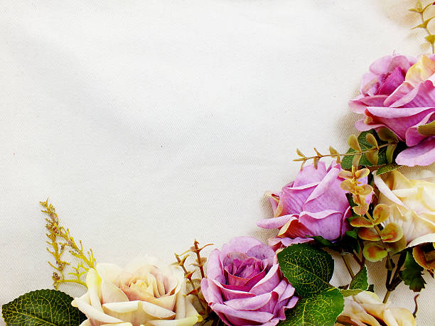 istock artificial purple rose flowers with space copy border background 628455278