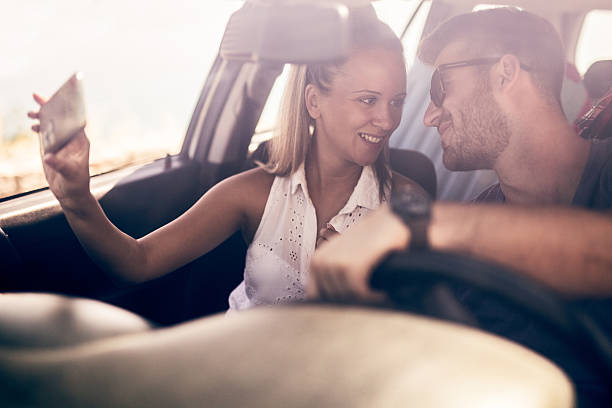istock Selfi young couple in car 628461720