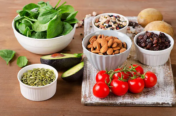 Foods containing potassium on  wooden table.