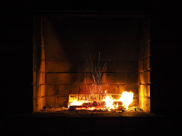 istock The fire in the fireplace. Firewood, charcoal, beautiful spark 628462732