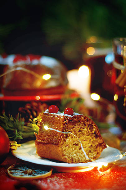 istock Piece of christmas pudding cake decorated with berries 628463264