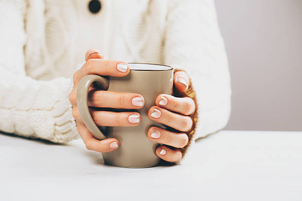 istock Woman with cup of hot coffee 628469738