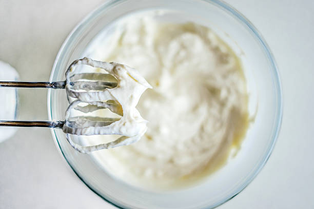 preparation of dough with electric whisk - whipped cream imagens e fotografias de stock