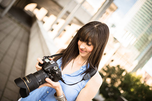 istock brunette tourist with a camera in Montreal - Canada 628470744