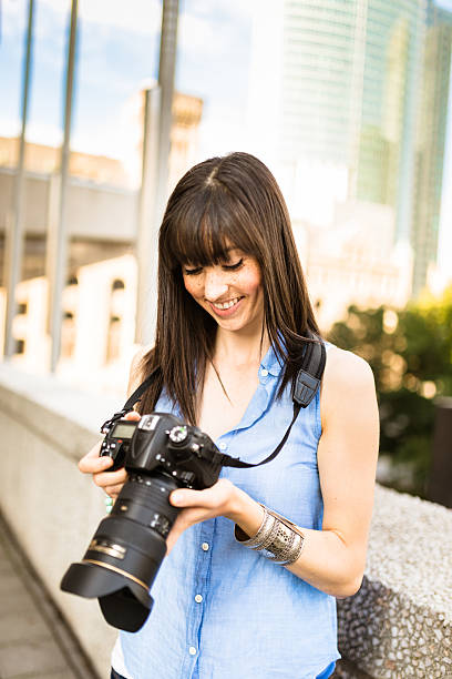 istock brunette tourist with a camera in Montreal - Canada 628470890