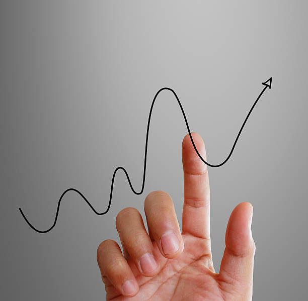 istock financial symbols coming from hand 628470962