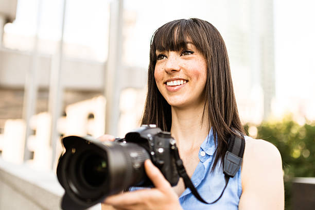 istock brunette tourist with a camera in Montreal - Canada 628471060