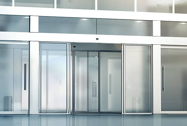 Blank sliding glass doors entrance mockup Blank sliding glass doors entrance mockup, 3d rendering. Commercial automatic slide entry mock up. Office building exterior template. Closed transparent business centre facade, front view. automatic stock pictures, royalty-free photos & images