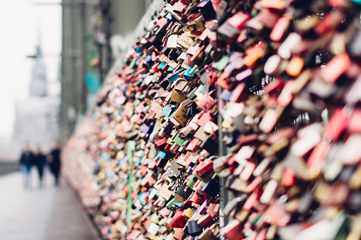 Since 2008 people have placed love padlocks on the fence between the footpath and the railway lines. 