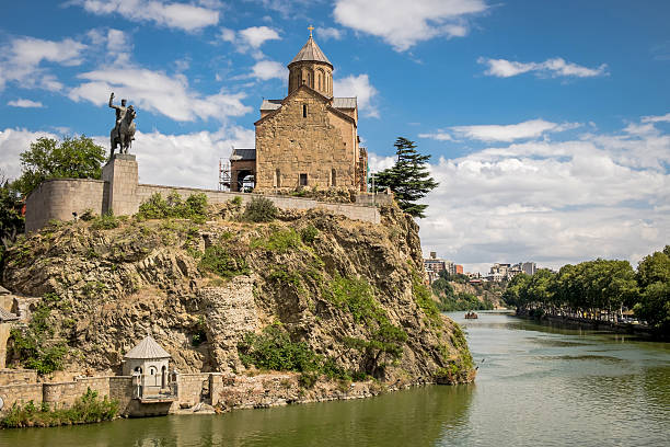 Metekhi Church and Monument of King in Tbilisi stock photo